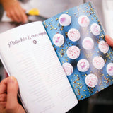 The Cake Book open to Pistachio & rose cupcakes recipe with Crumbs & Doilies style cupcakes and photography.